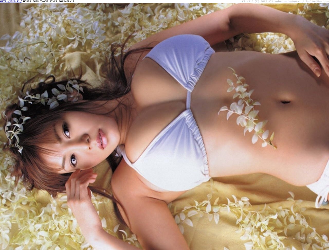 Asian girl in a bed of flowers, in swimwear (in Softcore Erotic Babes)
