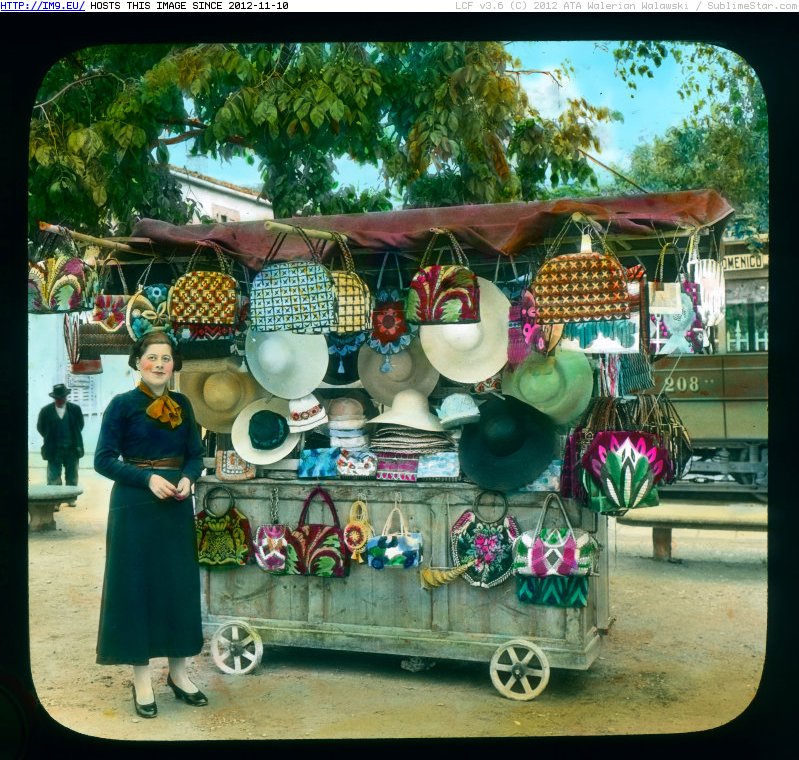 Fiesole - hat stand cart at Fiesole, with colorful hats and purses (1919-1938).2625 (in Branson DeCou Stock Images)